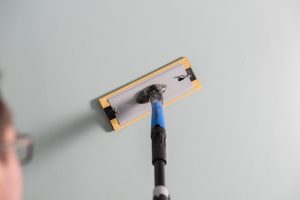 Slipebrett festet på forlengerskaft